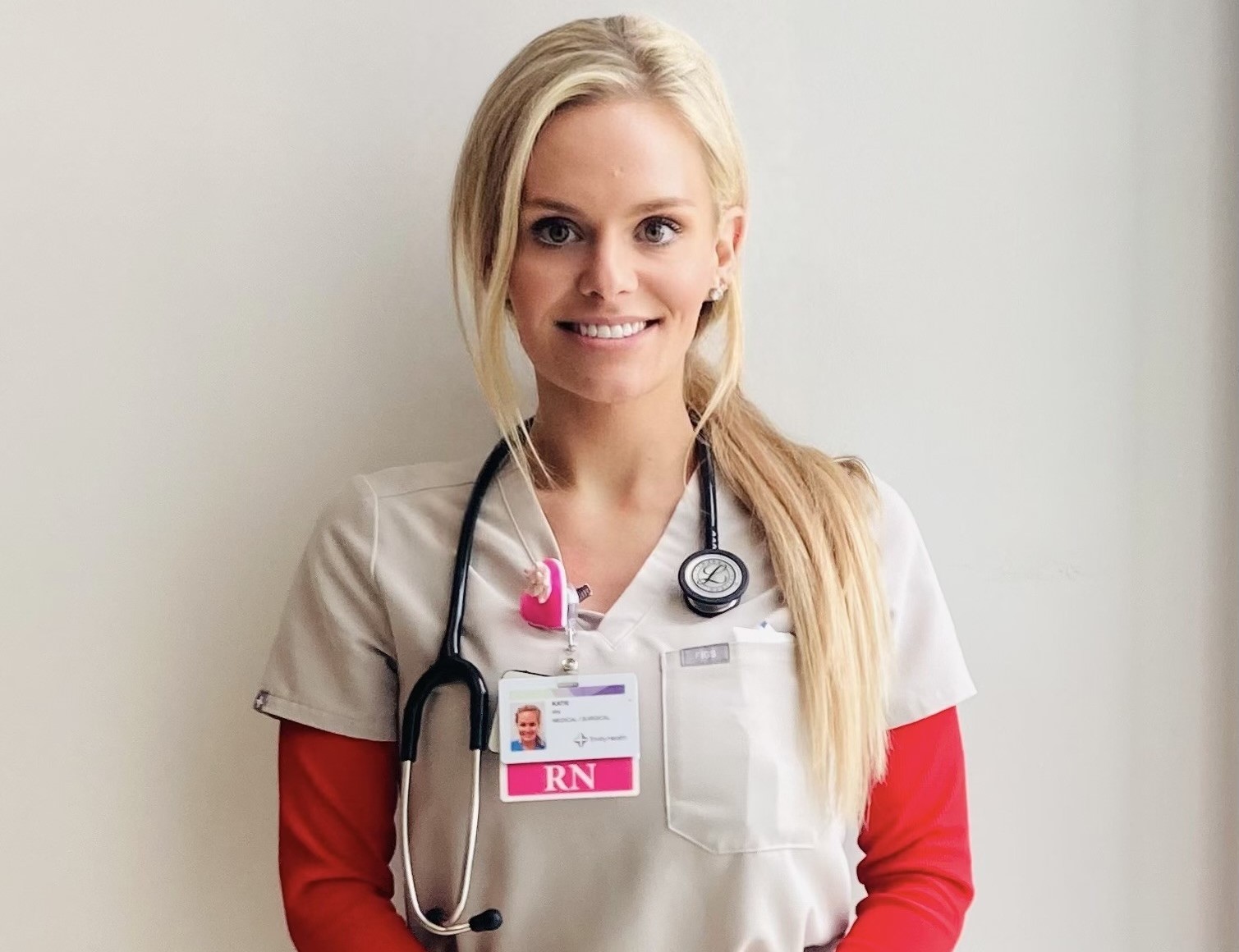 Katie Momber wearing scrubs